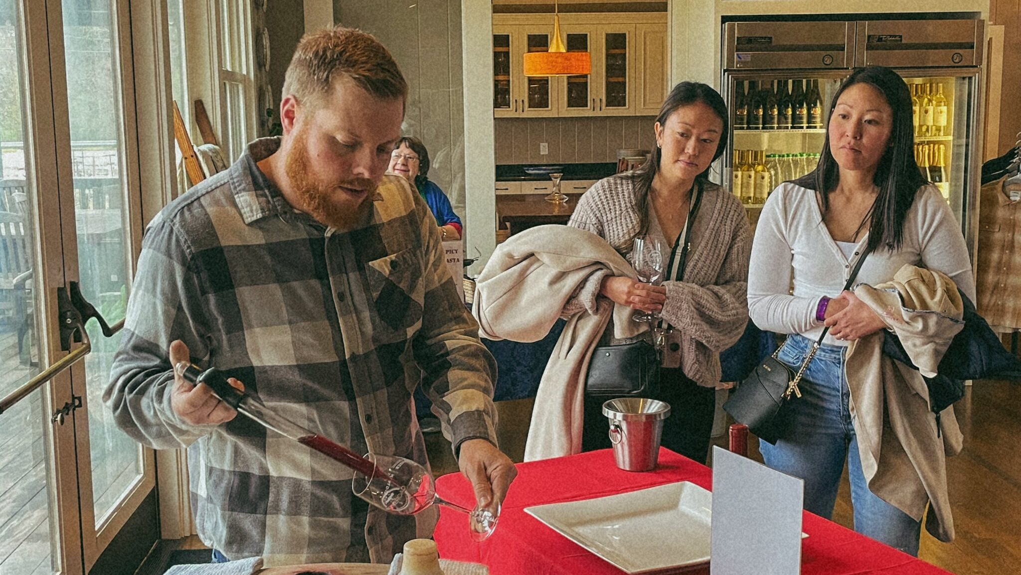 Orsi Family Vineyards Winemaker Bill Guadagni pouring barrel samples